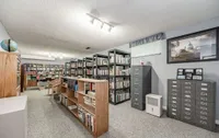 Finished basement set up as a home library with floor-to-ceiling bookshelves