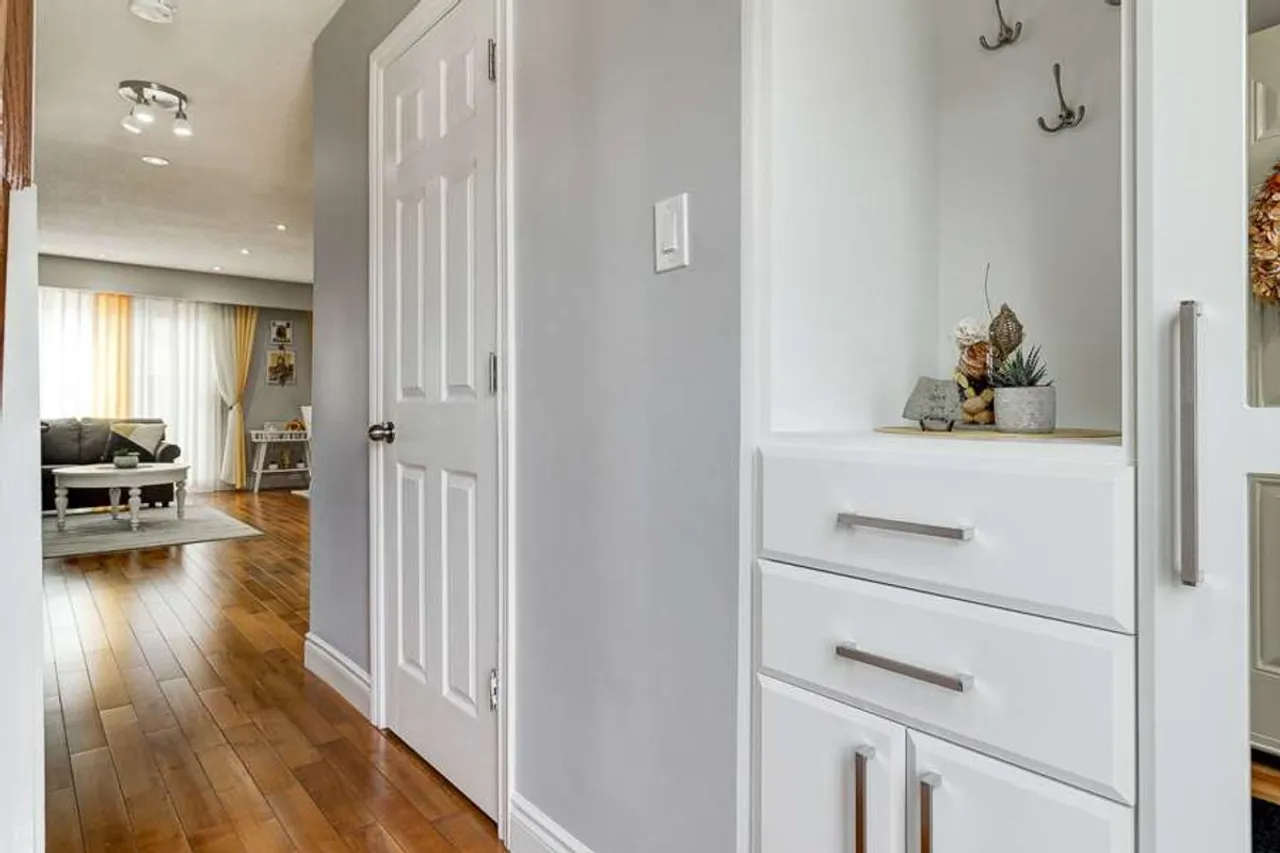 Entryway closet and coat hooks near the front door