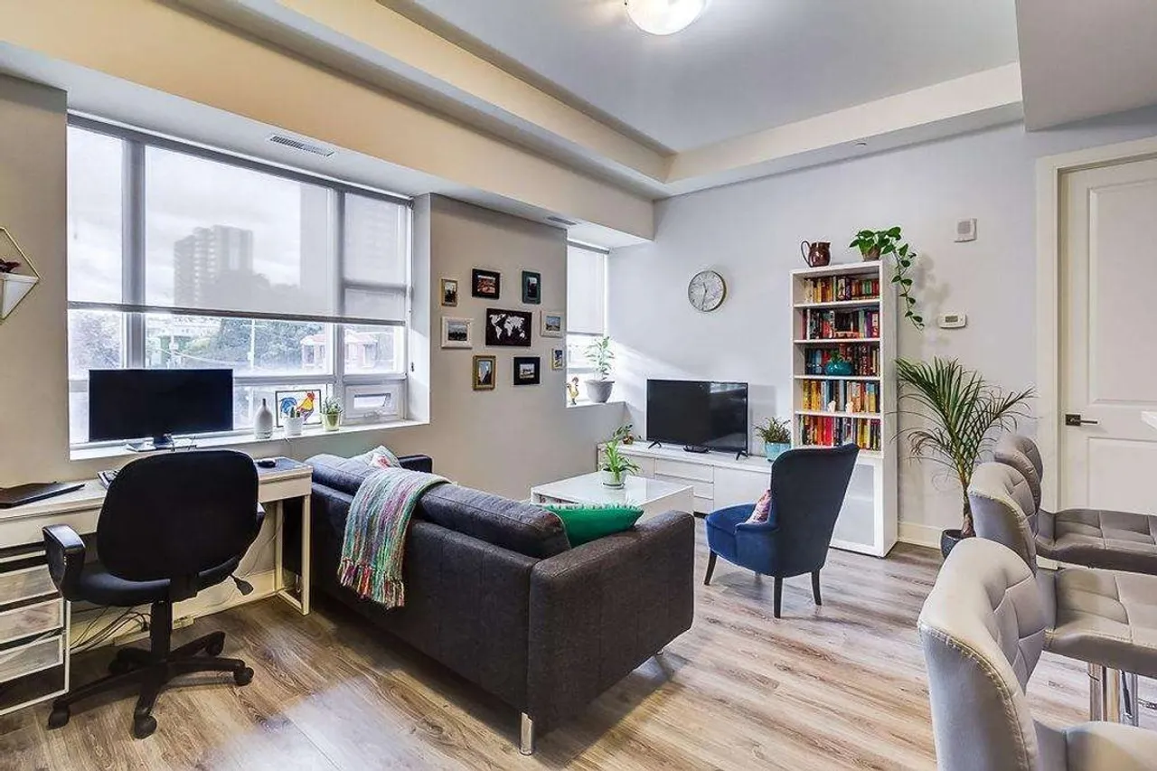 Living room with a desk and office nook by the window