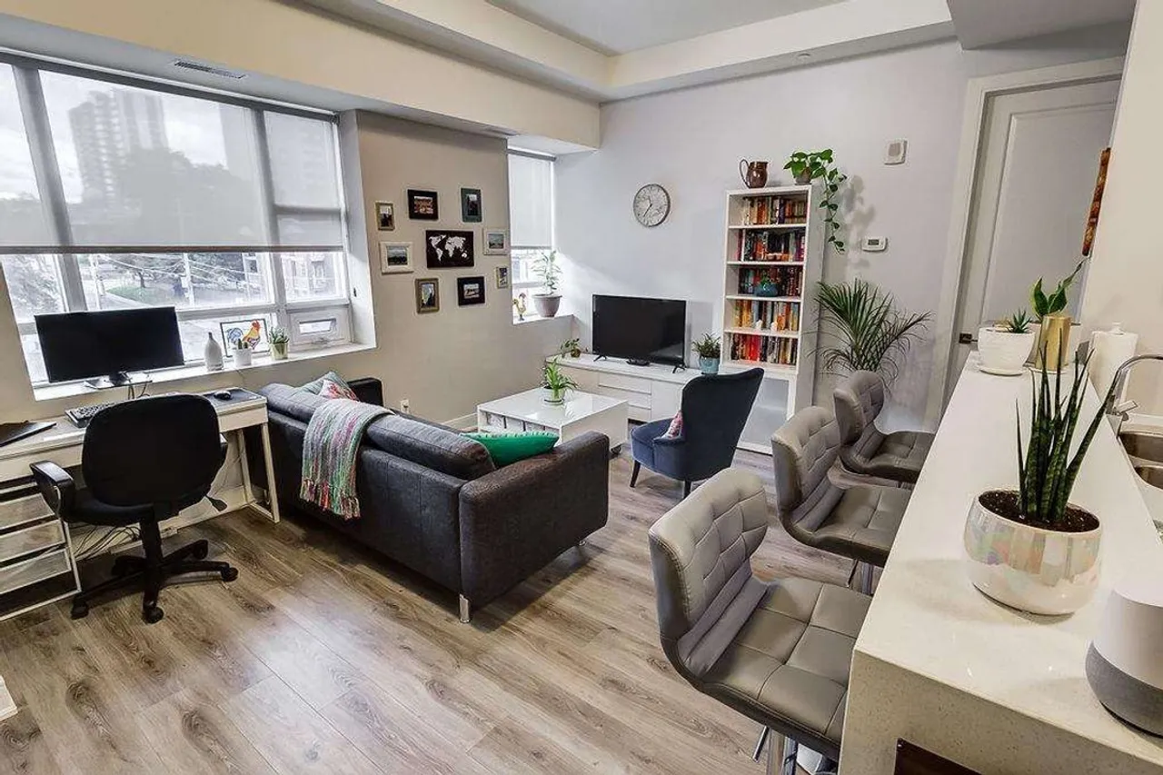 Living room with city views and a bookshelf