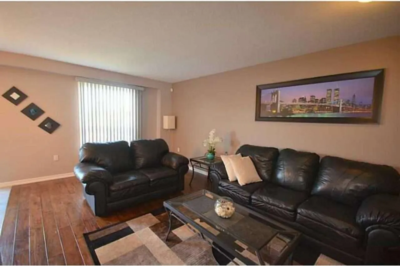 Living room with a city skyline framed art piece