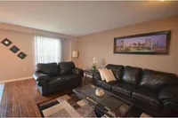 Living room with a city skyline framed art piece