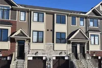 Front exterior of a modern townhouse row on Rymal Road East