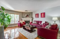 Family room with red leather sofas and a gas fireplace