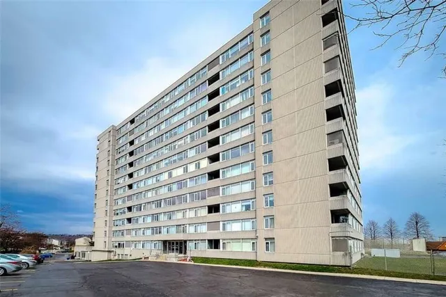 High-rise condo building exterior with balconies on Harrisford Street