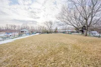 Large, private backyard backing onto mature trees