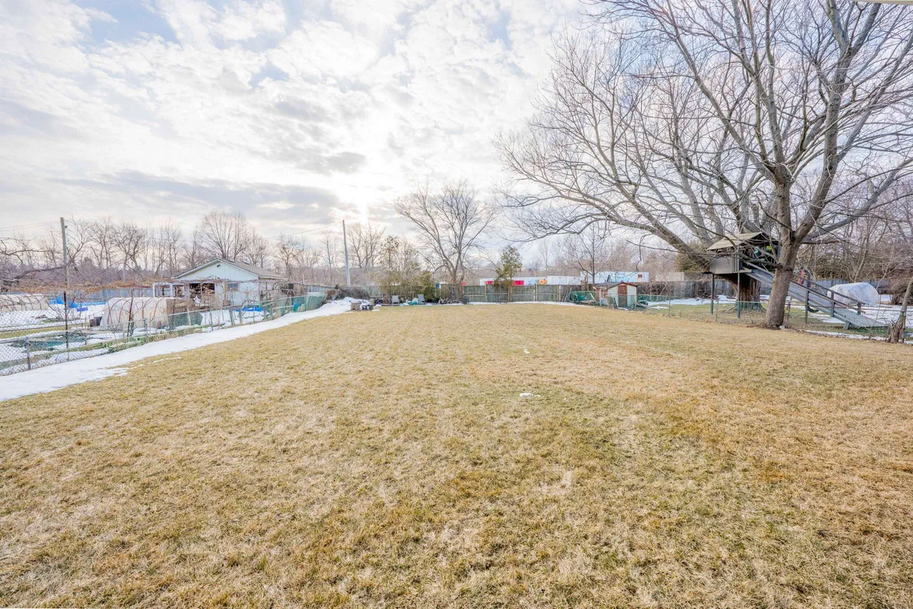 Large, private backyard backing onto mature trees
