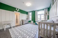Upper-level bedroom with board-and-batten wainscoting