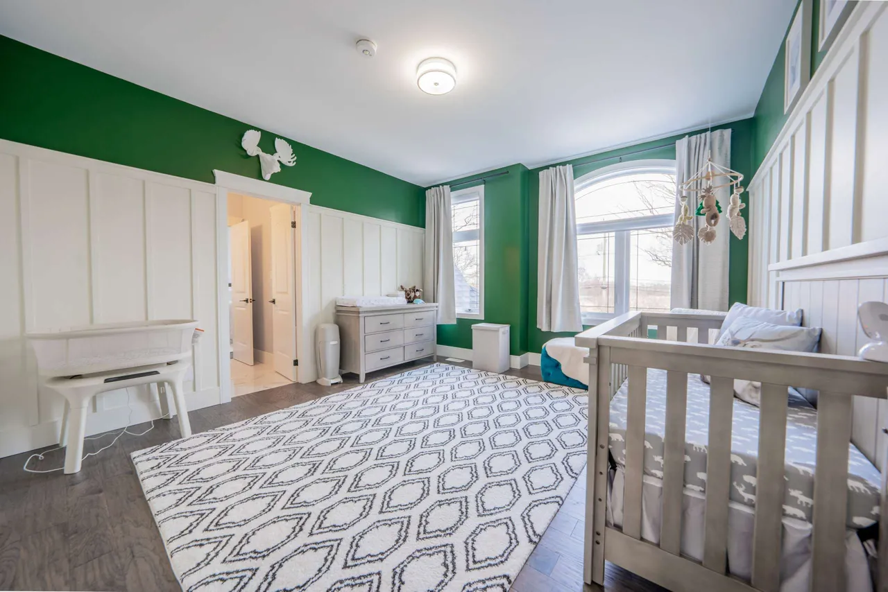 Upper-level bedroom with board-and-batten wainscoting