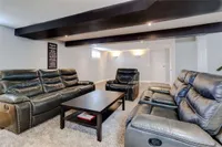 Lower-level family room with leather reclining sofas