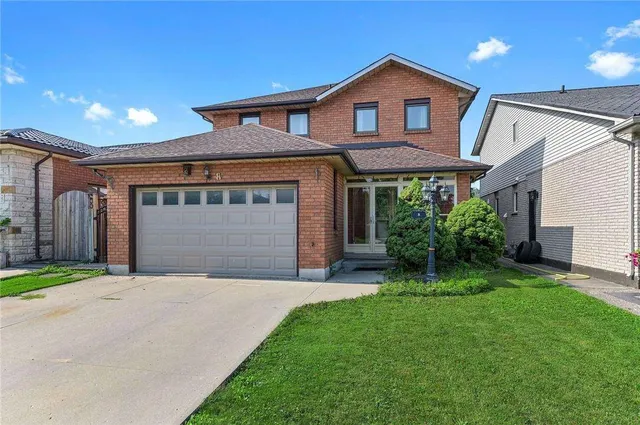 Front exterior of a two-storey brick home on Dynasty Avenue with a double garage