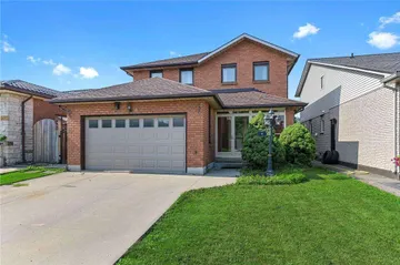 Front exterior of a two-storey brick home on Dynasty Avenue with a double garage