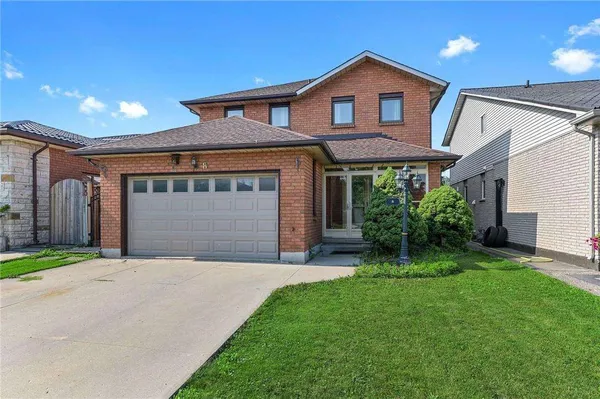 Front exterior of a two-storey brick home on Dynasty Avenue with a double garage