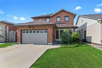 Front exterior of a two-storey brick home on Dynasty Avenue with a double garage