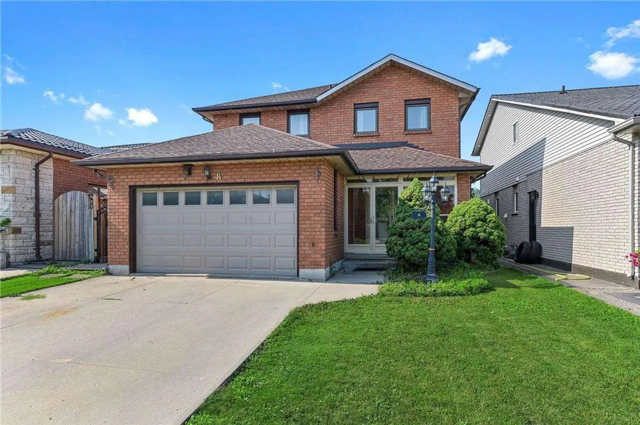 Front exterior of a two-storey brick home on Dynasty Avenue with a double garage