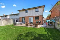 Rear exterior showing the covered patio and fenced backyard