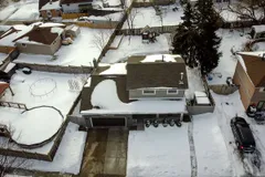 Aerial winter exterior view of 9 Hopewell Crescent showing the home, driveway, and backyard