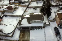 Aerial winter exterior view of 9 Hopewell Crescent showing the home, driveway, and backyard