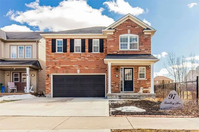 Front exterior of a two-storey brick home with double garage on Bradley Avenue