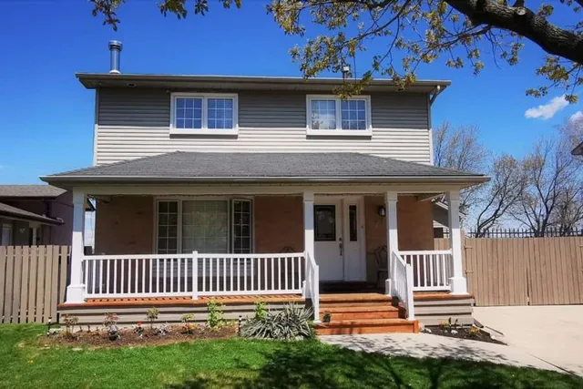 Front exterior of a two-storey brick home on Chilton Drive