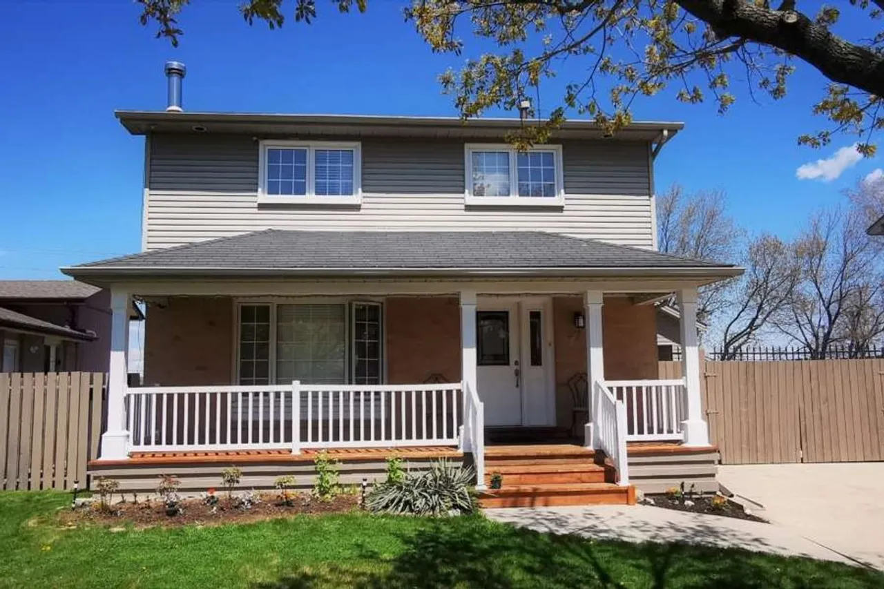 Front exterior of a two-storey brick home on Chilton Drive