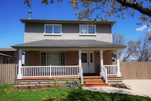 Front exterior of a two-storey brick home on Chilton Drive