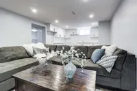 In-law suite living room in the finished basement with a sectional sofa