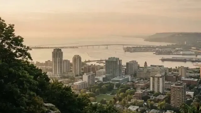 View from the Niagara Escarpment over downtown Hamilton, the harbour, and the Skyway bridge at sunset